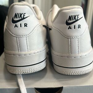 Nike Air Force 1 white with black swoosh. Size 6Y
